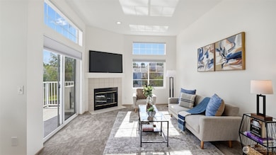 Cozy up by the fireplace or step out to the balcony — this bright space is perfect for every season.