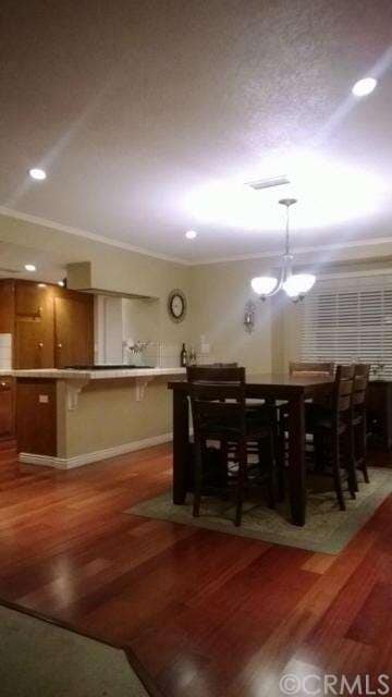 Kitchen opens to a large eating area .