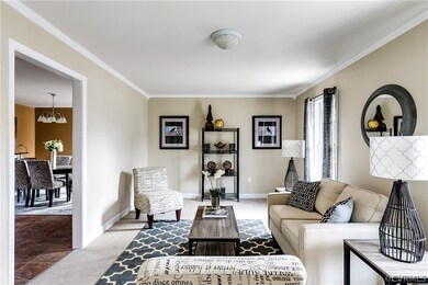 Living room with view into kitchen eat-in area