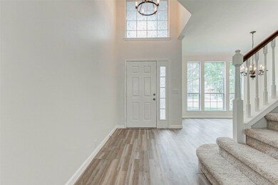A bright and inviting foyer immediately impresses