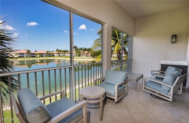 Sunroom / solarium featuring a water view