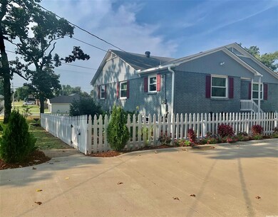Picket fenced yard plus wood privacy fence. Patio