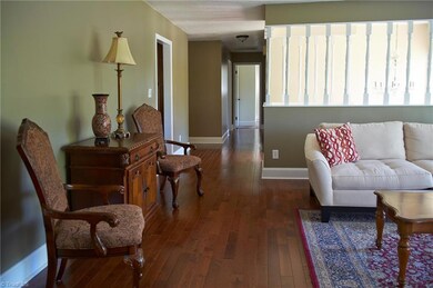 Hallway leads to 3 bedrooms and 2 full baths