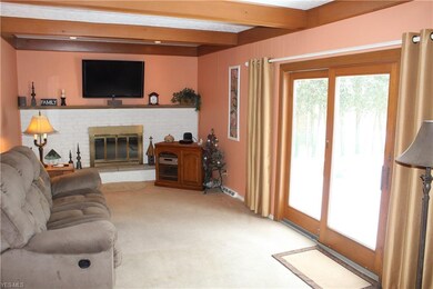 Cozy family room with wood-burning fireplace and s