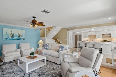 Living room with light hardwood / wood-style floor