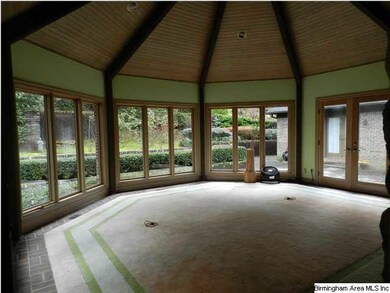 Grand foyer with brick floors and tall ceilings!