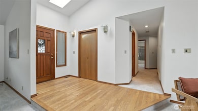 Enjoy beautifully maintained hardwood flooring separating the entry way from the living spaces.