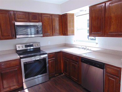 SS appliances and refinished counters.