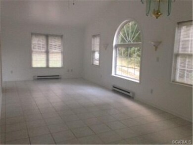 The great room with picturesque window and double 