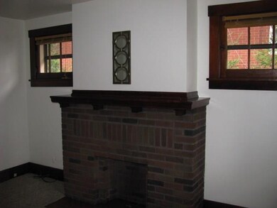 The Living Room welcomes you with a brick fireplac