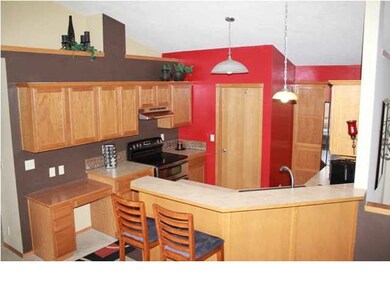 Kitchen has vaulted ceiling, planter shelves, pant