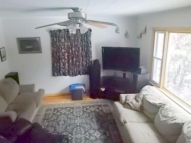 VIEW OF THE LIVING ROOM FROM STAIRWAY