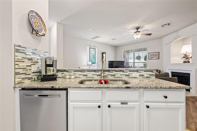 Kitchen featuring stainless steel dishwasher, ope