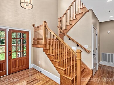 Staircase to upper level; two bedrooms, one bath.