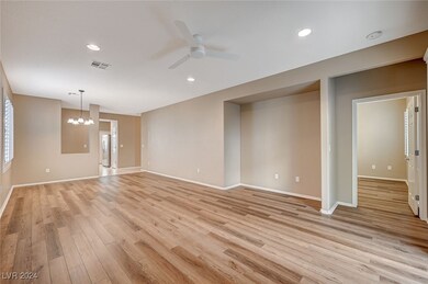 Living room with entry to primary BR
