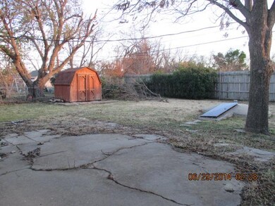 Back yard has nice size storage building and stora