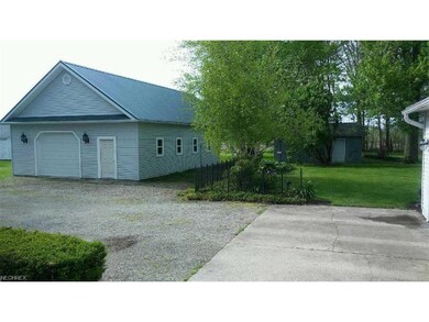 27 x 36 pole barn on left, small garage/shed in ba