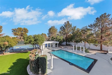 View of pool featuring a Full Court Basketball/Pic
