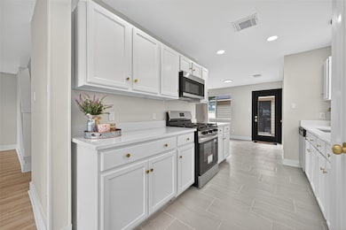 Functional kitchen with ample cabinetry.