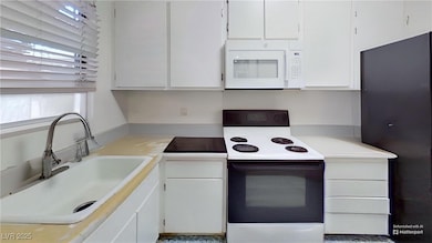 1569 Defurnished Kitchen with range with electric