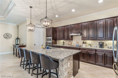 Kitchen featuring hanging light fixtures, stainles