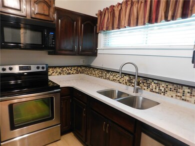 Kitchen with double bowl sink and disposal.
