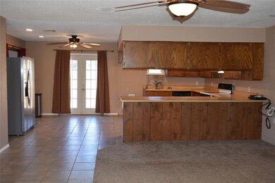 Kitchen with french doors, kitchen peninsula, elec