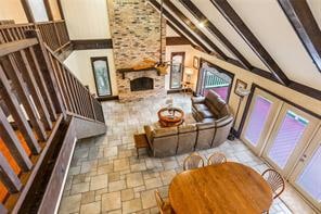 IMPRESSIVE VIEW OVER INTO DEN AND DINING.  LARGE WINDOWS SHARE GREAT VIEWS OF OUTSIDE.  INTRICATE DETAILS ON THE BEAUTIFUL BRICK FIREPLACE