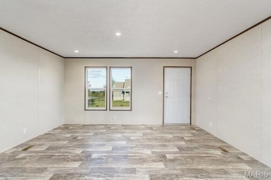 Unfurnished room with wood finished floors, recessed lighting, and crown molding