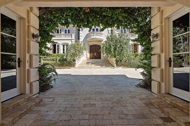 Under Porte-cochere looking at Main home