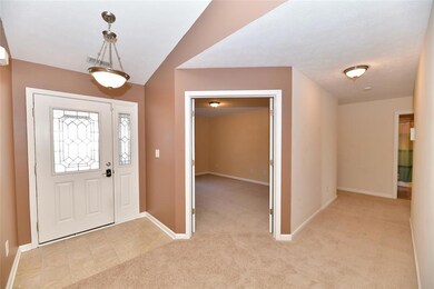 Entry w/lovely door & sidelight. ALL NEW CARPET THROUGHOUT!
