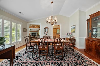 Dining area with wood finished floors, an inviting