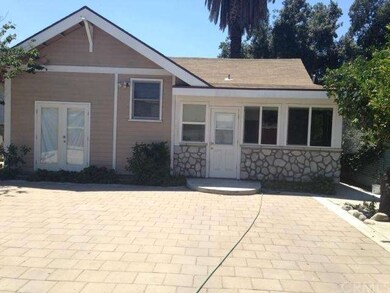 Back view of lthe home and addition done with perm