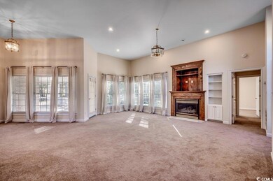 Unfurnished living room with light colored carpet,