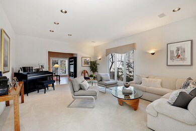 Separate living room opens to family room and foye