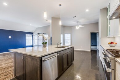 remodeled kitchen  with gas range, open floor plan and breakfast room
