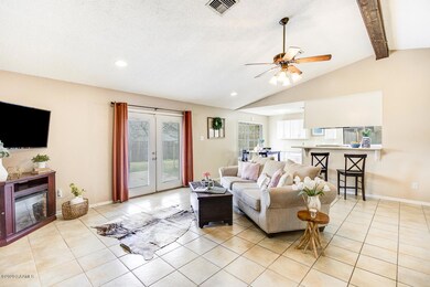 Living room open to kitchen and dining