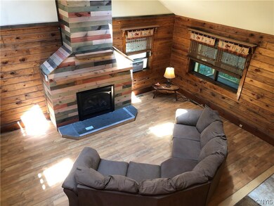 Looking down from the loft into the living area wi