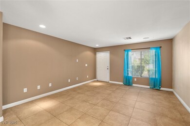 Empty room with recessed lighting, light tile patt