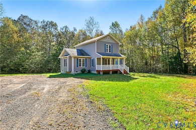 Traditional-style house featuring crawl space, driveway, a front lawn, roof with shingles, and a porch