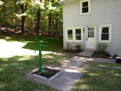 Hand well pump and rear entrance