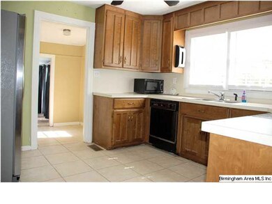 View of nice sized kitchen with tile floor with ap
