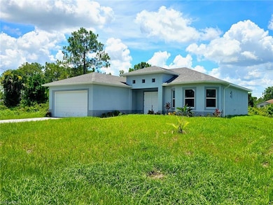 View of front facade with a garage, stucco siding, a shingled roof, and a front lawn