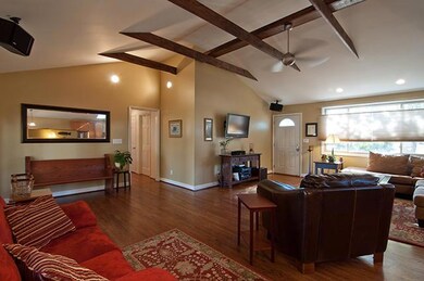 Vaulted and beamed ceiling, all new sheetrock and electrical. Surround sound speakers (which remain), custom blinds throughout the entire house and gorgeous hardwood floors. This is truly a lifestyle house. 