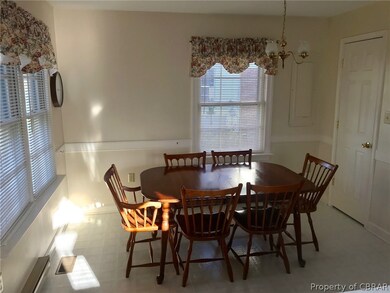 Dining area of kitchen with pantry to right