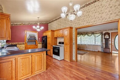 Kitchen featuring a high ceiling, a chandelier, da