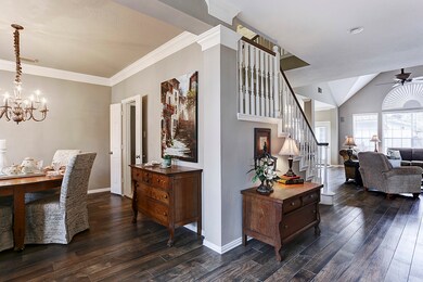 Inside the home you'll be greeted by gorgeous wood-like tile running throughout the downstairs entertaining areas, as well as beautiful architectural detail and refined paint colors.
