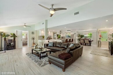 living room with a view to a french door that leads to the master bedroom.