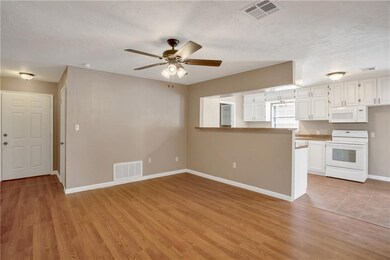 Front door to the left and dining room