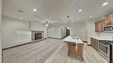 Kitchen featuring stainless steel appliances, a si